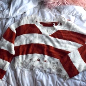 Cropped, frayed ends sweater